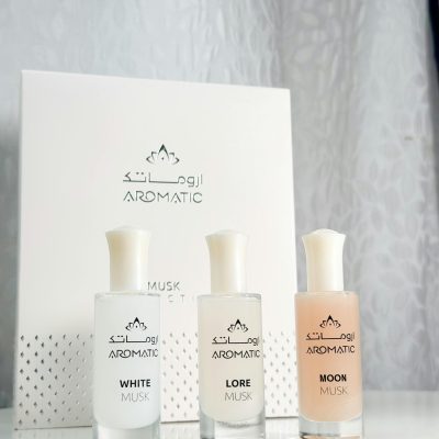 A stylish presentation of Aromatic musk perfumes featuring White, Lore, and Moon scents.